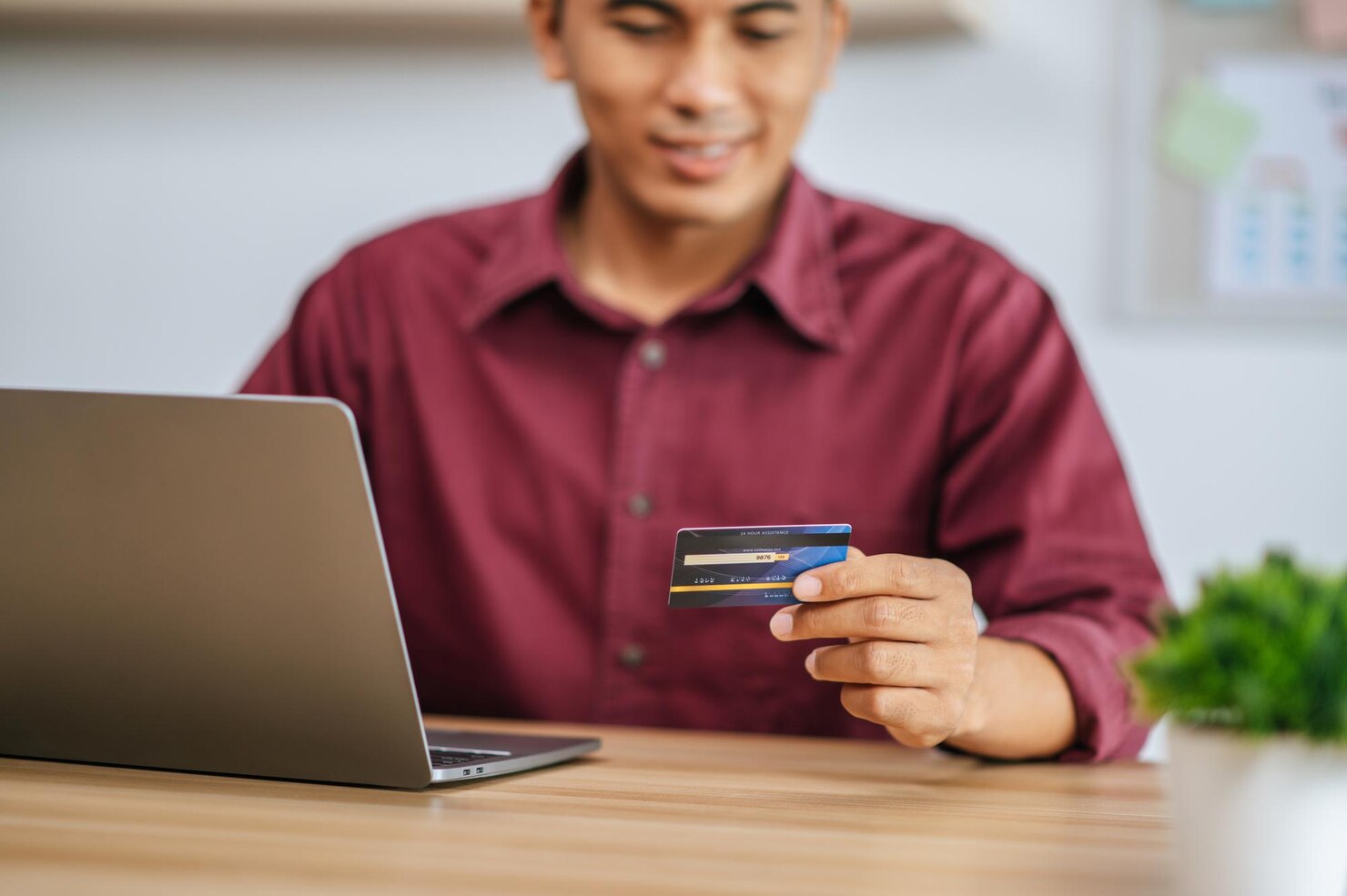 Employee using credit card for payment transaction